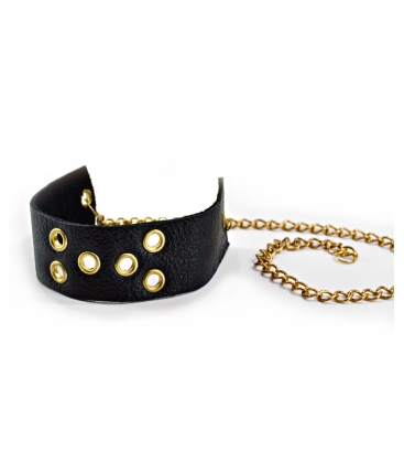 Attacchi d'arte, Bracciale in pelle nera a 6 fori dorati