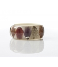 Antonella Piacenti, bracciale rigido in resina naturale epossidica, piume e argento. Colore multicolor PIUMA Sun